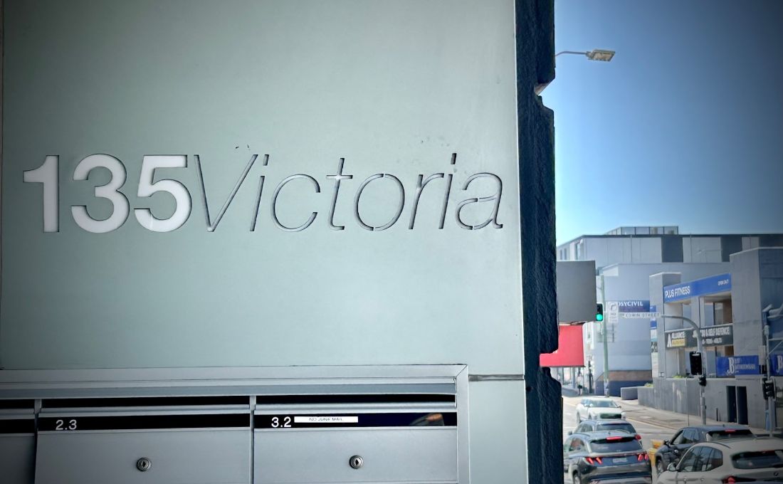 The 135 Victoria Road building sign in Drummoyne